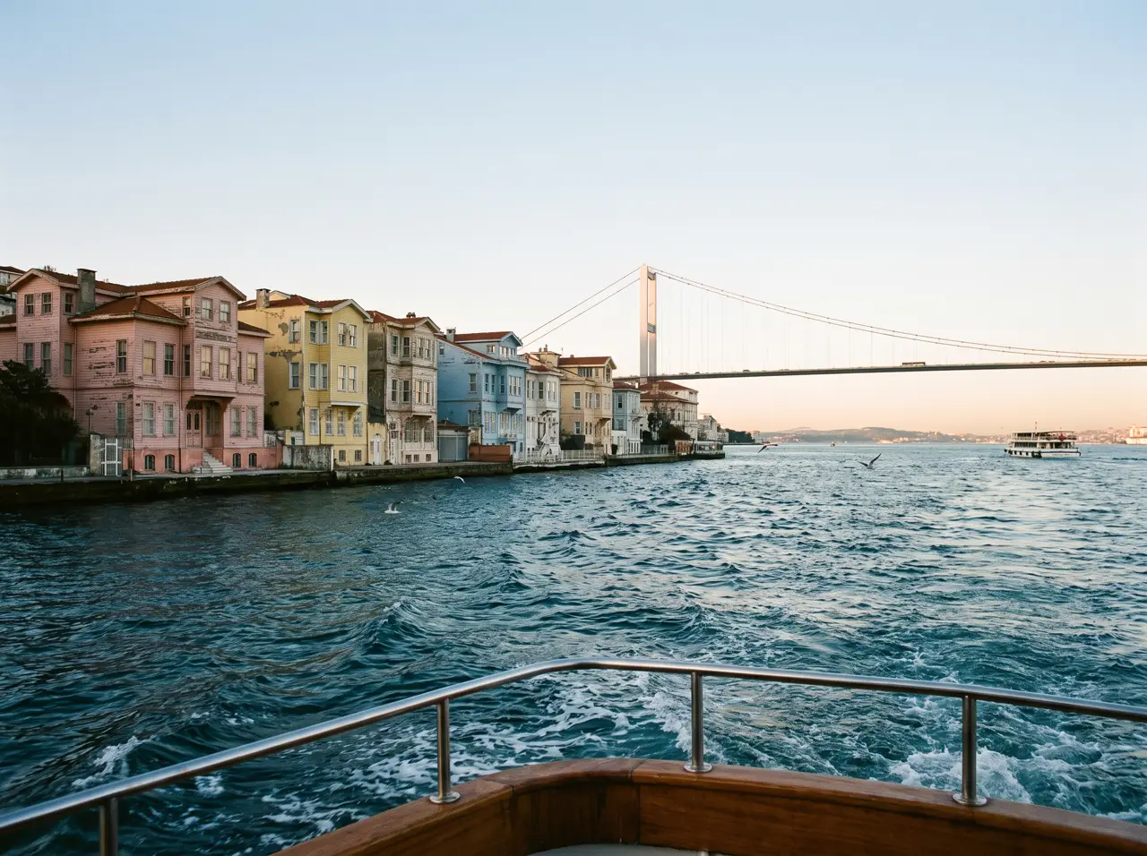 Private yacht on the Bosphorus with the bridge and Ortaköy Mosque behind