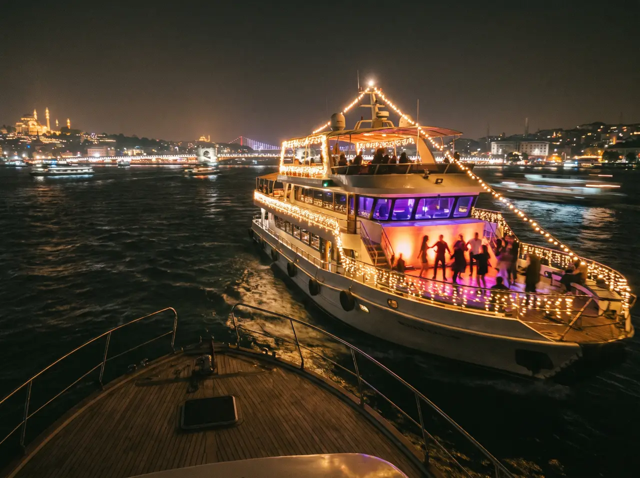 Event yacht with string lights and a large evening party on the Bosphorus